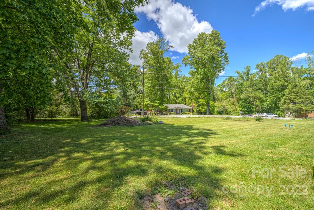 292 Brookside Camp Road Hendersonville, NC 28792 - Photo 41 of 41 a view of outdoor space with trees all around