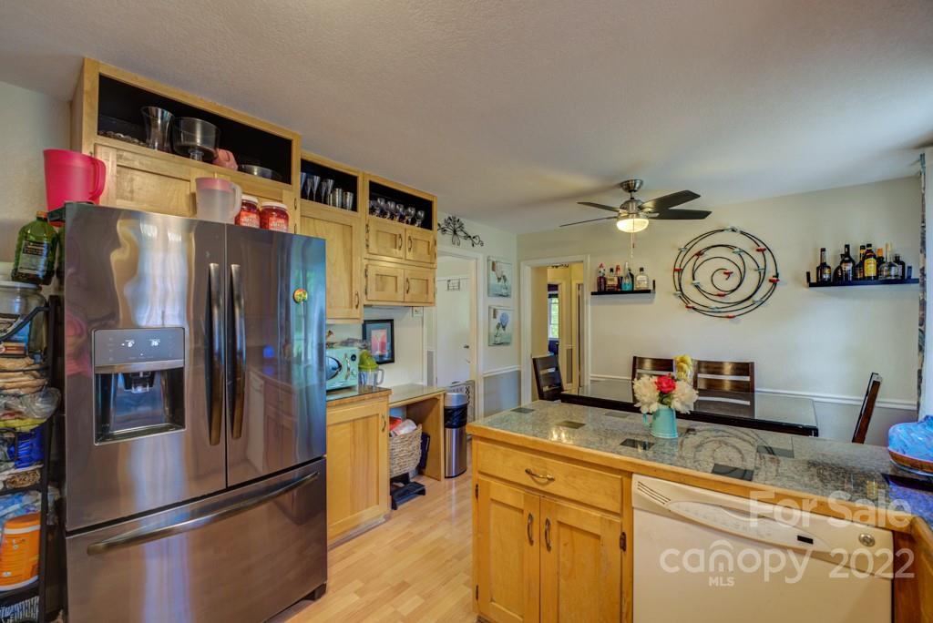 292 Brookside Camp Road Hendersonville, NC 28792 - Photo 8 of 41 a kitchen with stainless steel appliances granite countertop a refrigerator and a sink