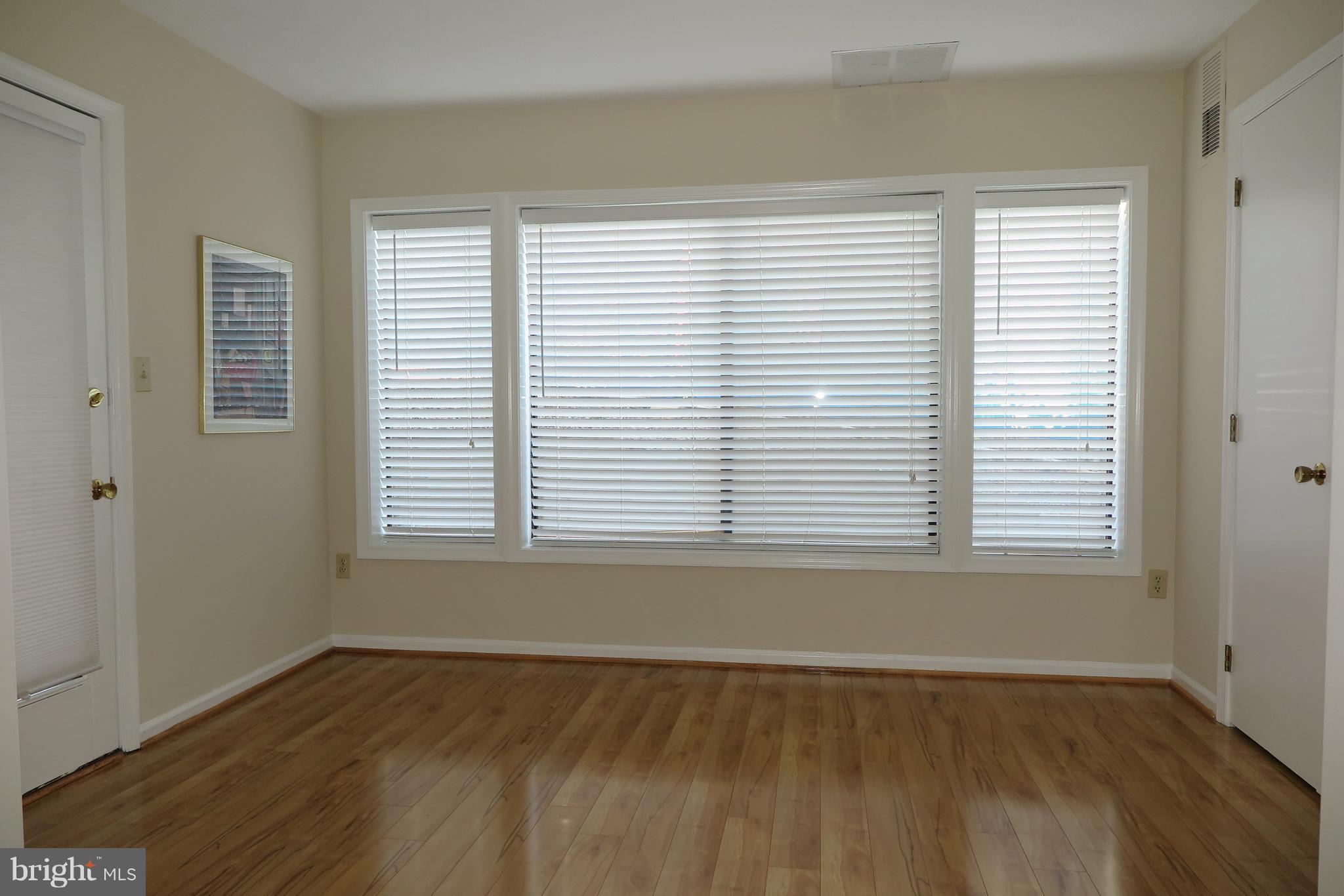 2211 Hunter's Run Drive, Unit 2211 Reston, VA 20191 - Photo 8 of 28 Den/Sunroom with door opening to patio