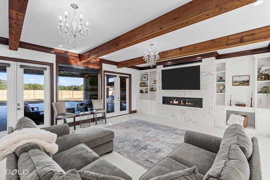 9480 McCain Road Shreveport, LA 71107 - Photo 11 of 40 a living room with furniture and a flat screen tv