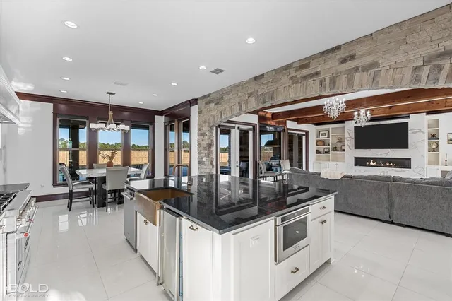 a kitchen with stainless steel appliances granite countertop a stove and a refrigerator