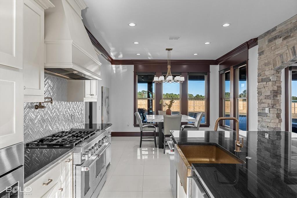 9480 McCain Road Shreveport, LA 71107 - Photo 15 of 40 a kitchen with stainless steel appliances granite countertop a stove and a refrigerator