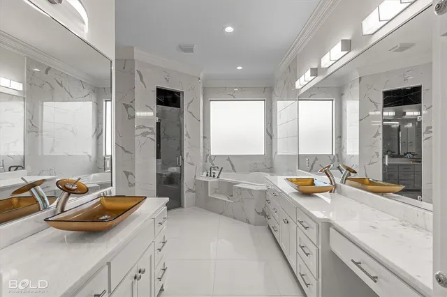 a spacious bathroom with a double vanity sink and a large mirror