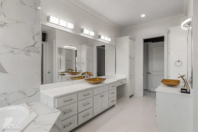 a bathroom with a tub sink and vanity