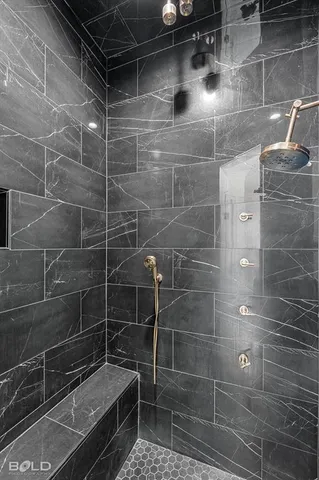 a view of an empty room with a fireplace