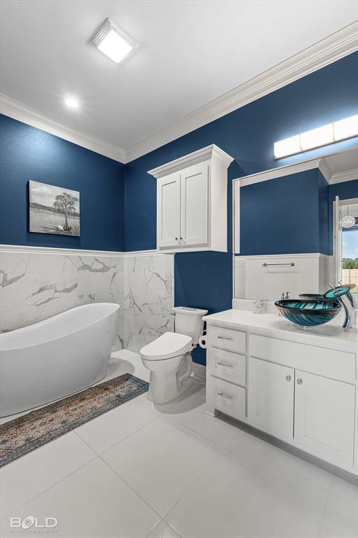 9480 McCain Road Shreveport, LA 71107 - Photo 25 of 40 a bathroom with a toilet sink and mirror