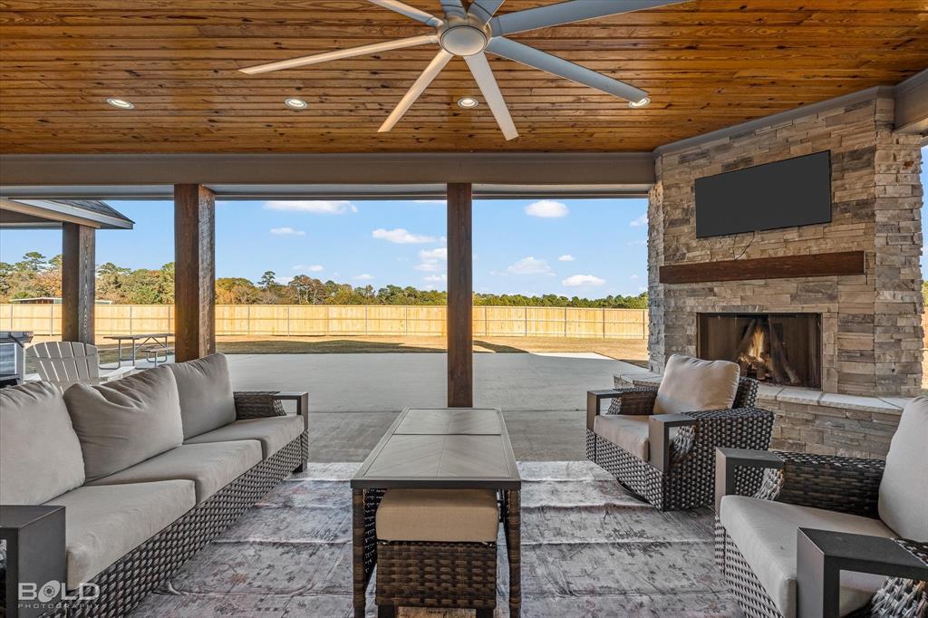 9480 McCain Road Shreveport, LA 71107 - Photo 30 of 40 a living room with furniture and a fireplace