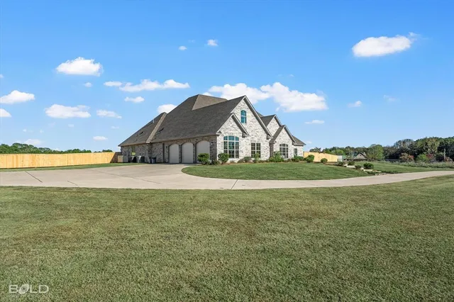 a view of a house with a big yard