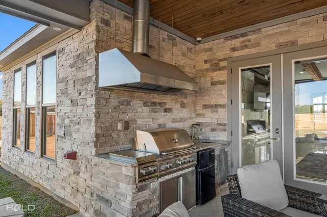 a living room with furniture a fireplace and a floor to ceiling window