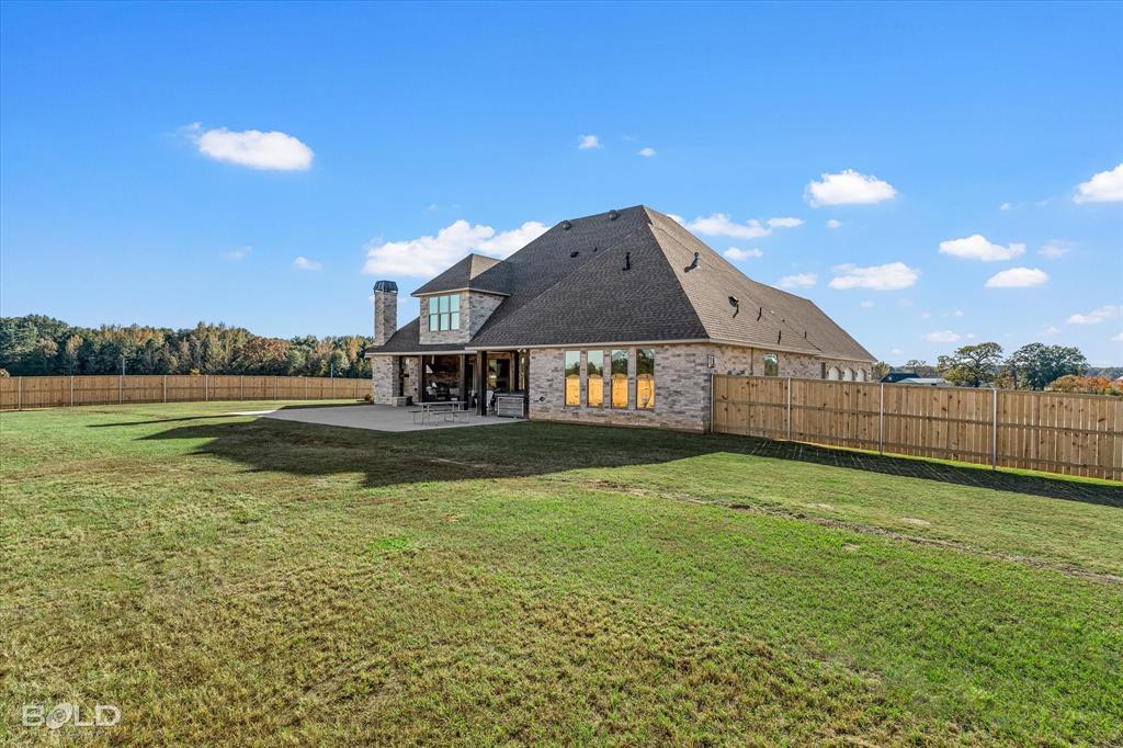 9480 McCain Road Shreveport, LA 71107 - Photo 36 of 40 a view of a house with a yard