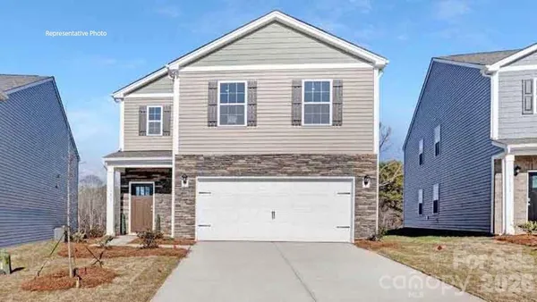 a front view of a house with yard