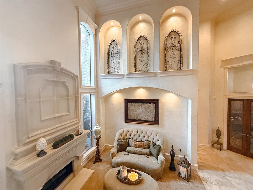 1919 Kings Pass Heath, TX 75032 - Photo 13 of 38 Sitting room featuring a premium fireplace and a high ceiling