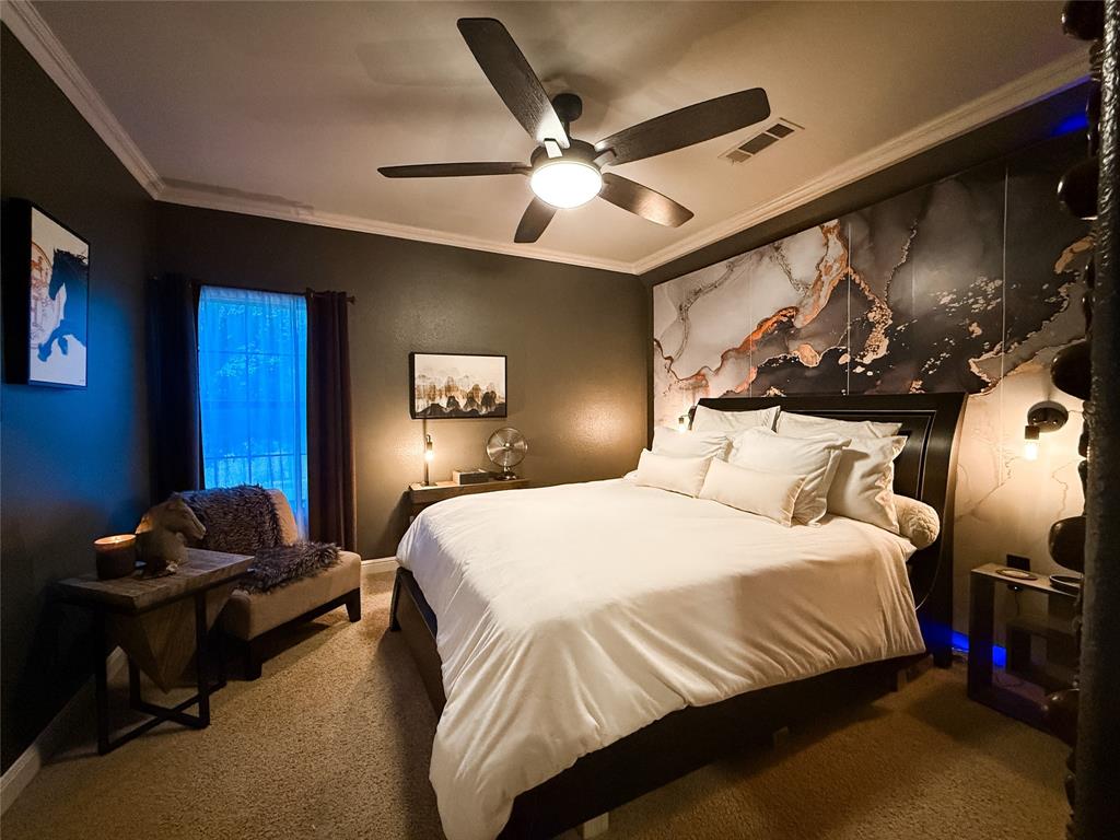 1919 Kings Pass Heath, TX 75032 - Photo 32 of 38 Carpeted bedroom featuring ornamental molding and ceiling fan