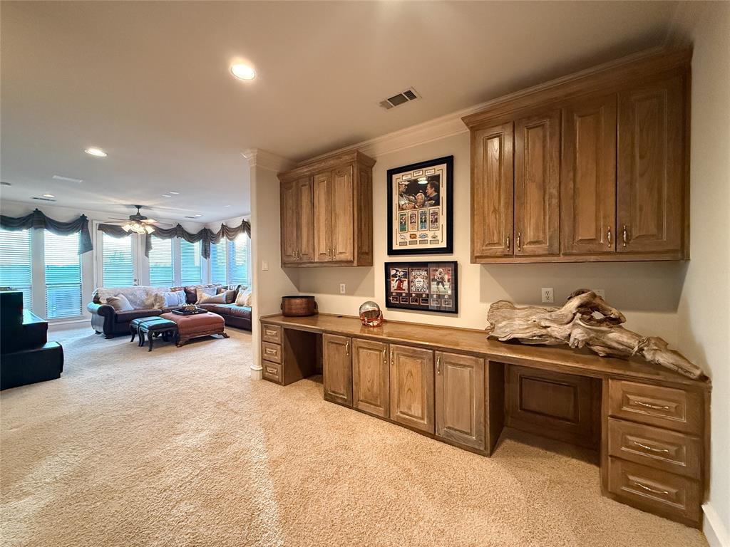1919 Kings Pass Heath, TX 75032 - Photo 37 of 38 Home office with built in study area, light carpet, crown molding, recessed lighting, and a ceiling fan