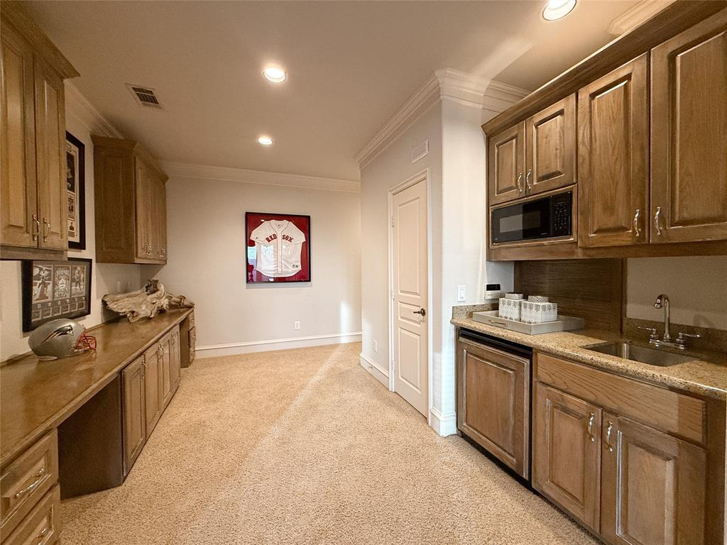 1919 Kings Pass Heath, TX 75032 - Photo 38 of 38 Kitchen featuring ornamental molding, recessed lighting, dishwasher, black microwave, and light colored carpet