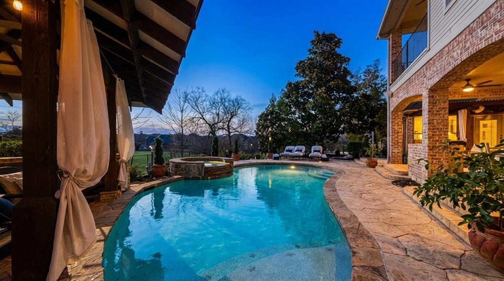 1919 Kings Pass Heath, TX 75032 - Photo 5 of 38 Integrated pool / spa with a patio area