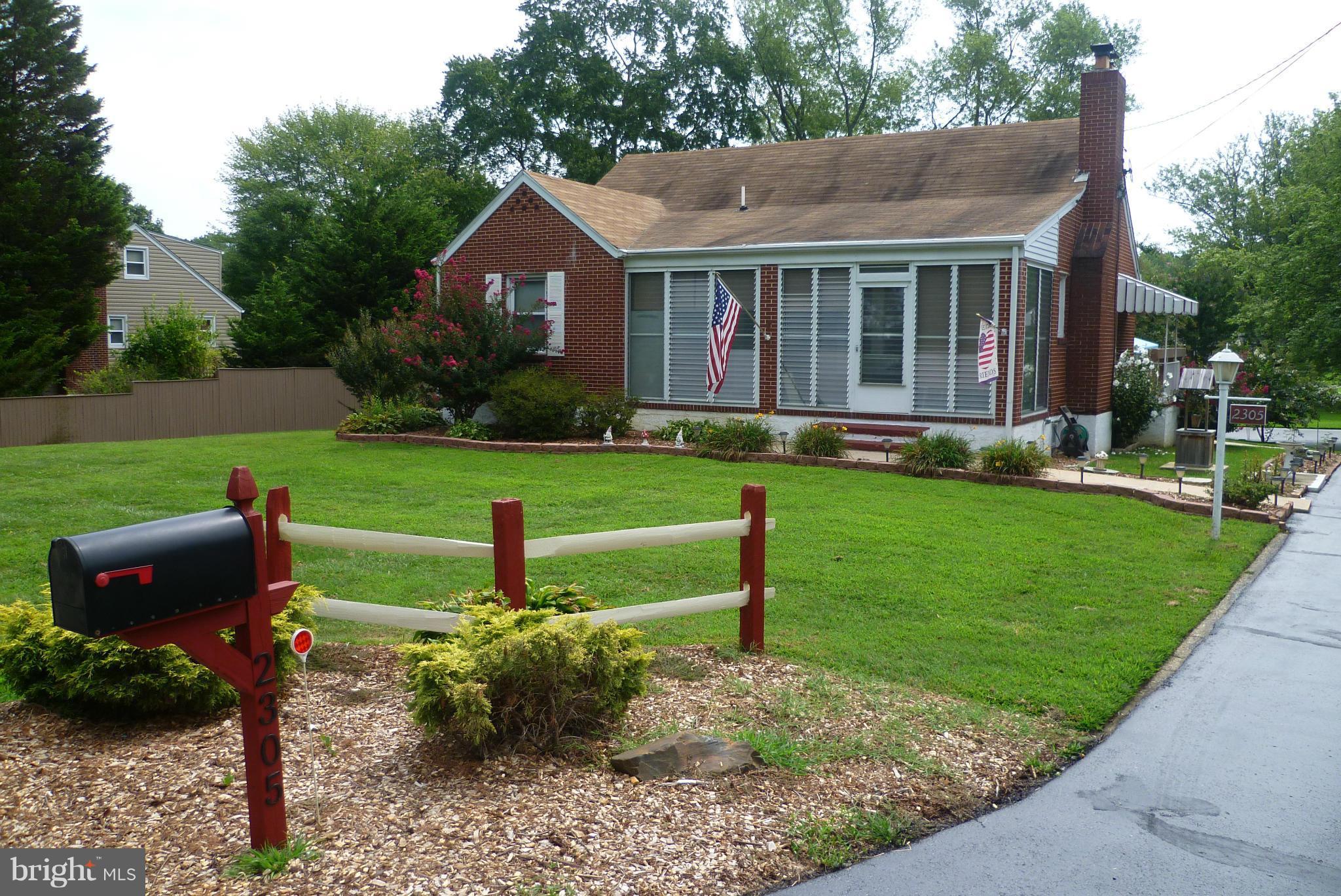 2305 Harford Road Fallston, MD 21047 - Photo 1 of 30 a front view of a house with a yard table and chairs