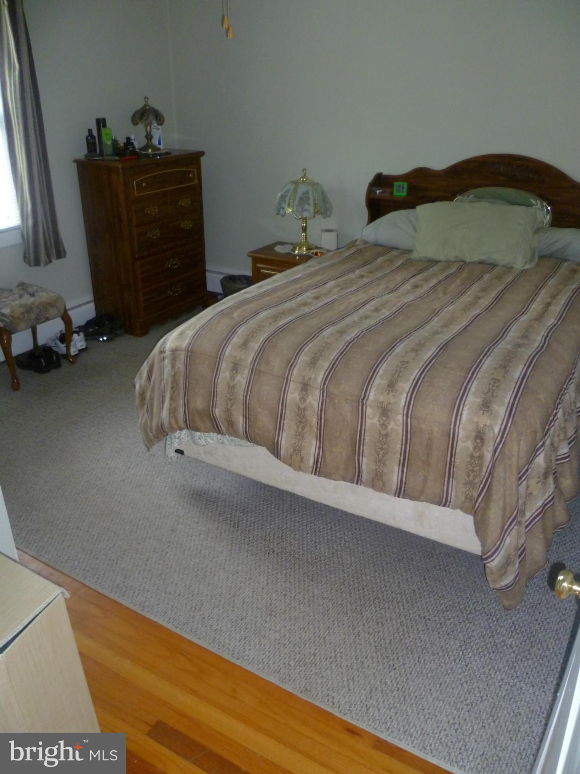 2305 Harford Road Fallston, MD 21047 - Photo 19 of 30 a bedroom with a bed and a dresser