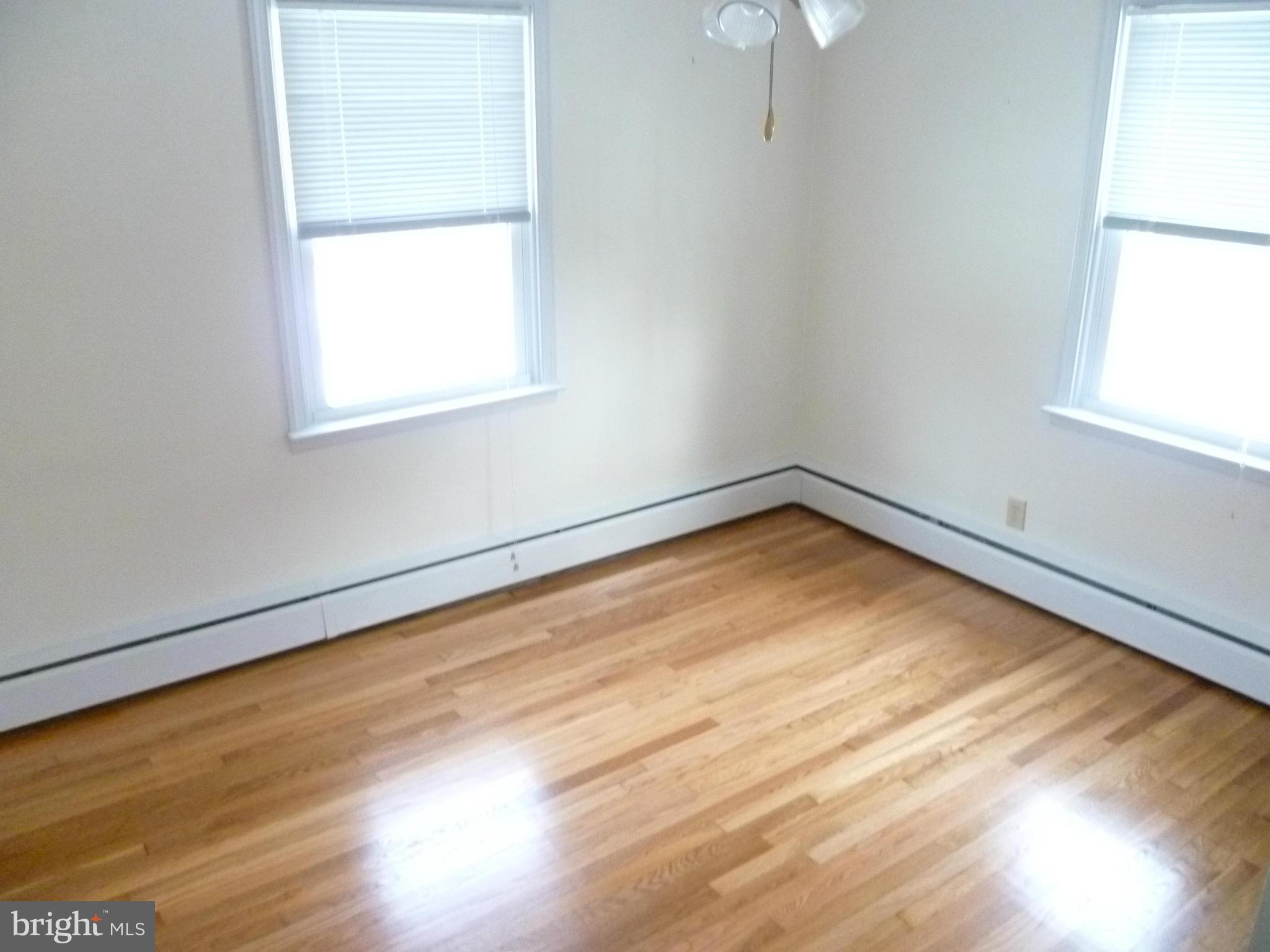 2305 Harford Road Fallston, MD 21047 - Photo 20 of 30 an empty room with wooden floor and windows