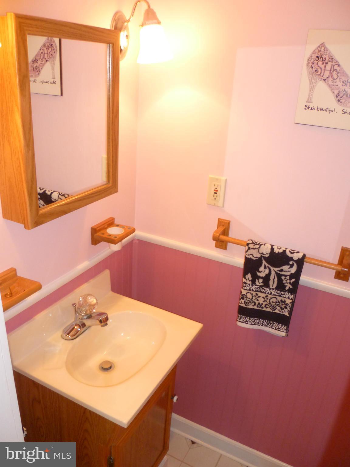 2305 Harford Road Fallston, MD 21047 - Photo 23 of 30 a bathroom with a sink a mirror and a toilet