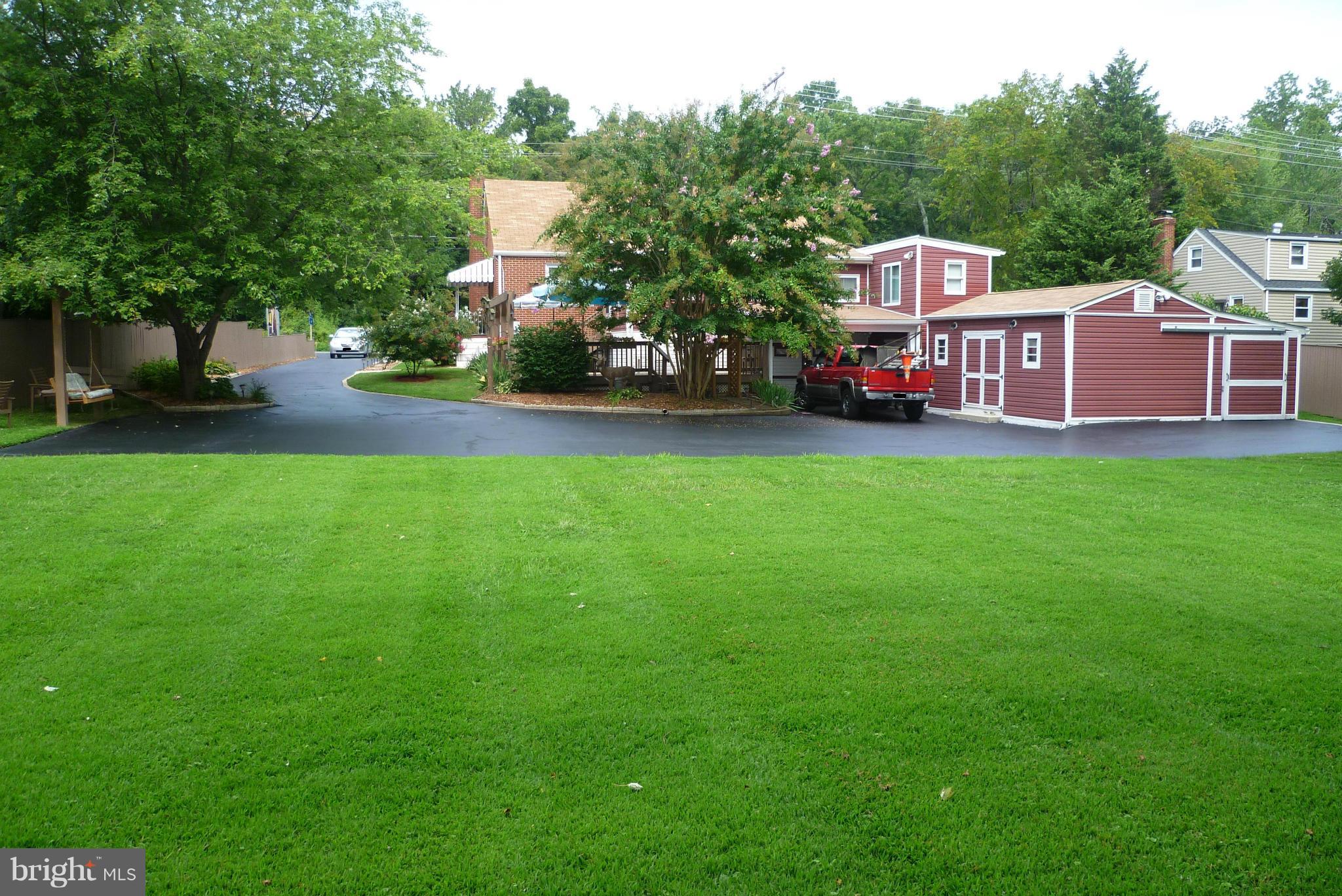 2305 Harford Road Fallston, MD 21047 - Photo 5 of 30 a view of a house with a big yard and large trees
