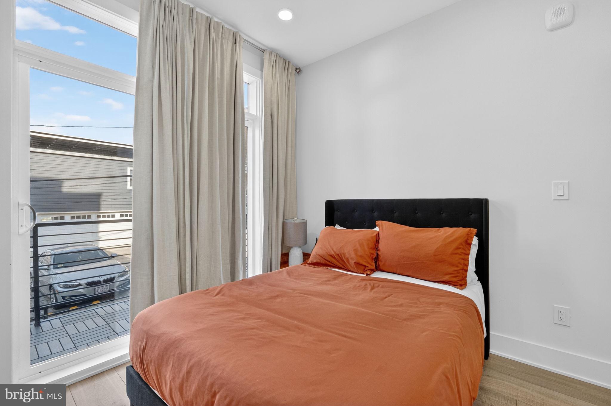 1307 Longfellow Street Northwest, Unit 8 Washington, DC 20011 - Photo 20 of 26 a bedroom with a bed and closet