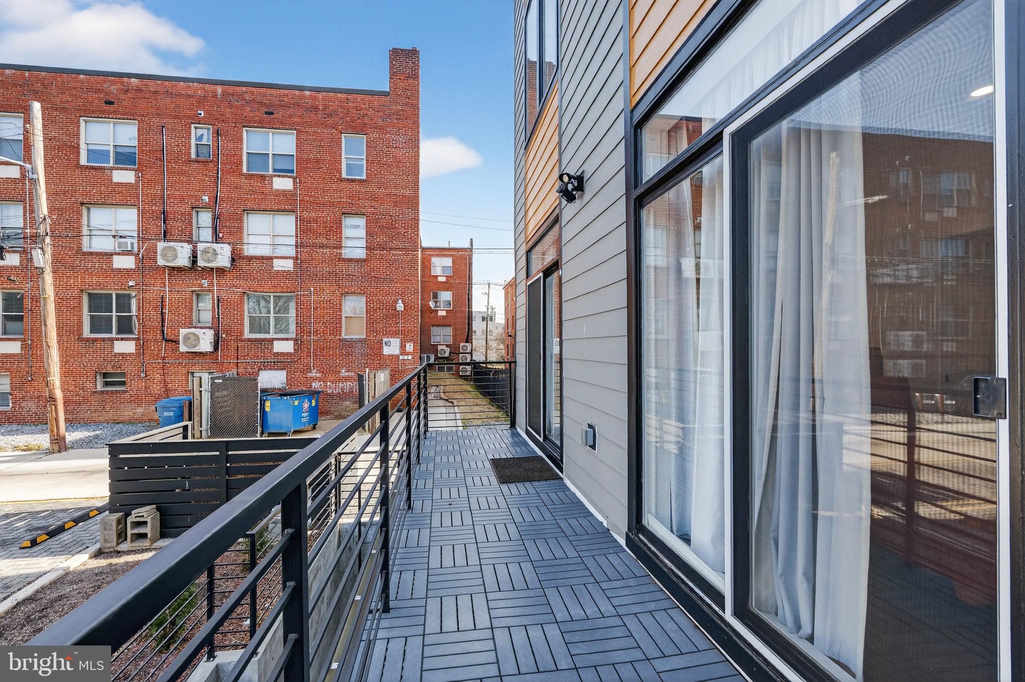 1307 Longfellow Street Northwest, Unit 8 Washington, DC 20011 - Photo 24 of 26 a city view from a balcony
