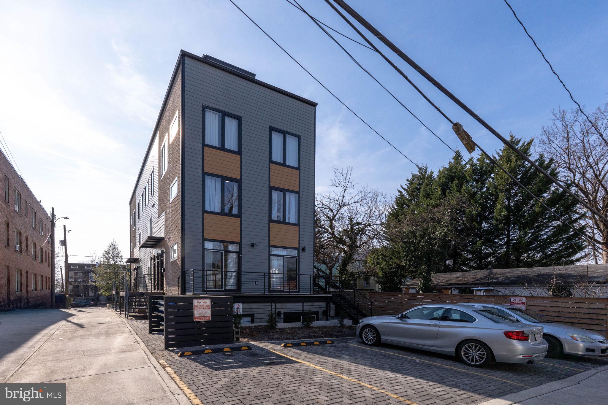 1307 Longfellow Street Northwest, Unit 8 Washington, DC 20011 - Photo 3 of 26 a view of a car parked in front of a building