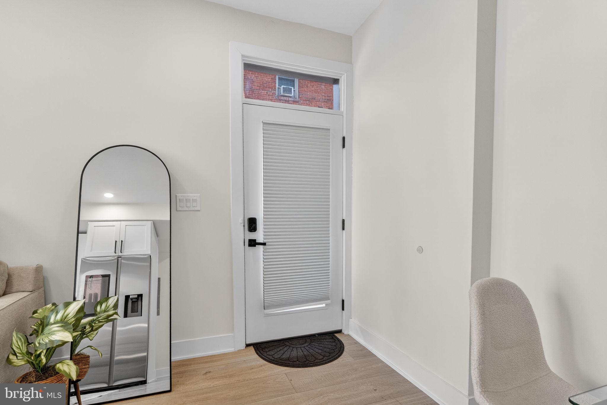 1307 Longfellow Street Northwest, Unit 8 Washington, DC 20011 - Photo 5 of 26 a view of an entryway with wooden floor