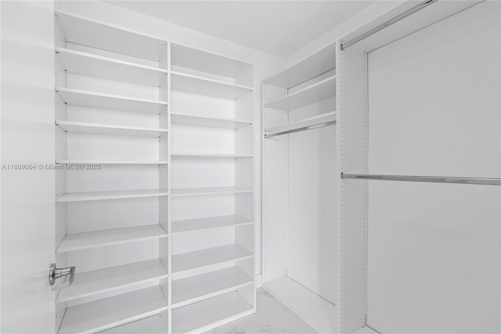 92 Southwest 3rd Street, Unit 5206 Miami, FL 33130 - Photo 9 of 21 a view of walk in closet with empty racks