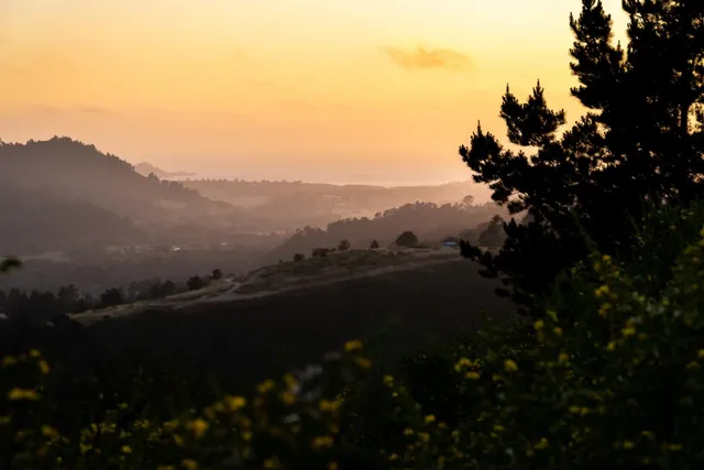 a view of a mountain with a swimming pool