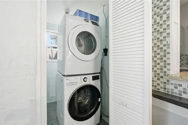 a view of a hallway with washer and dryer