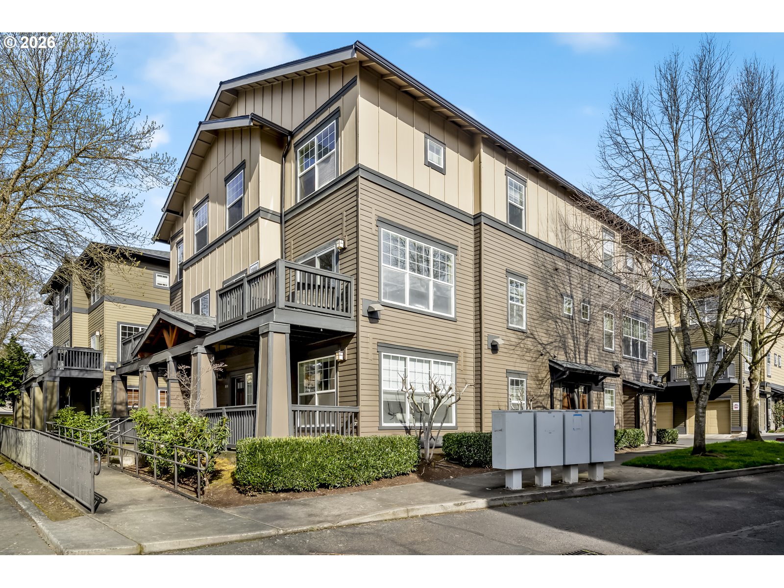 1100 Southwest 170th Avenue, Unit 100 Beaverton, OR 97003 - Photo 1 of 17 a front view of a residential apartment building with a yard