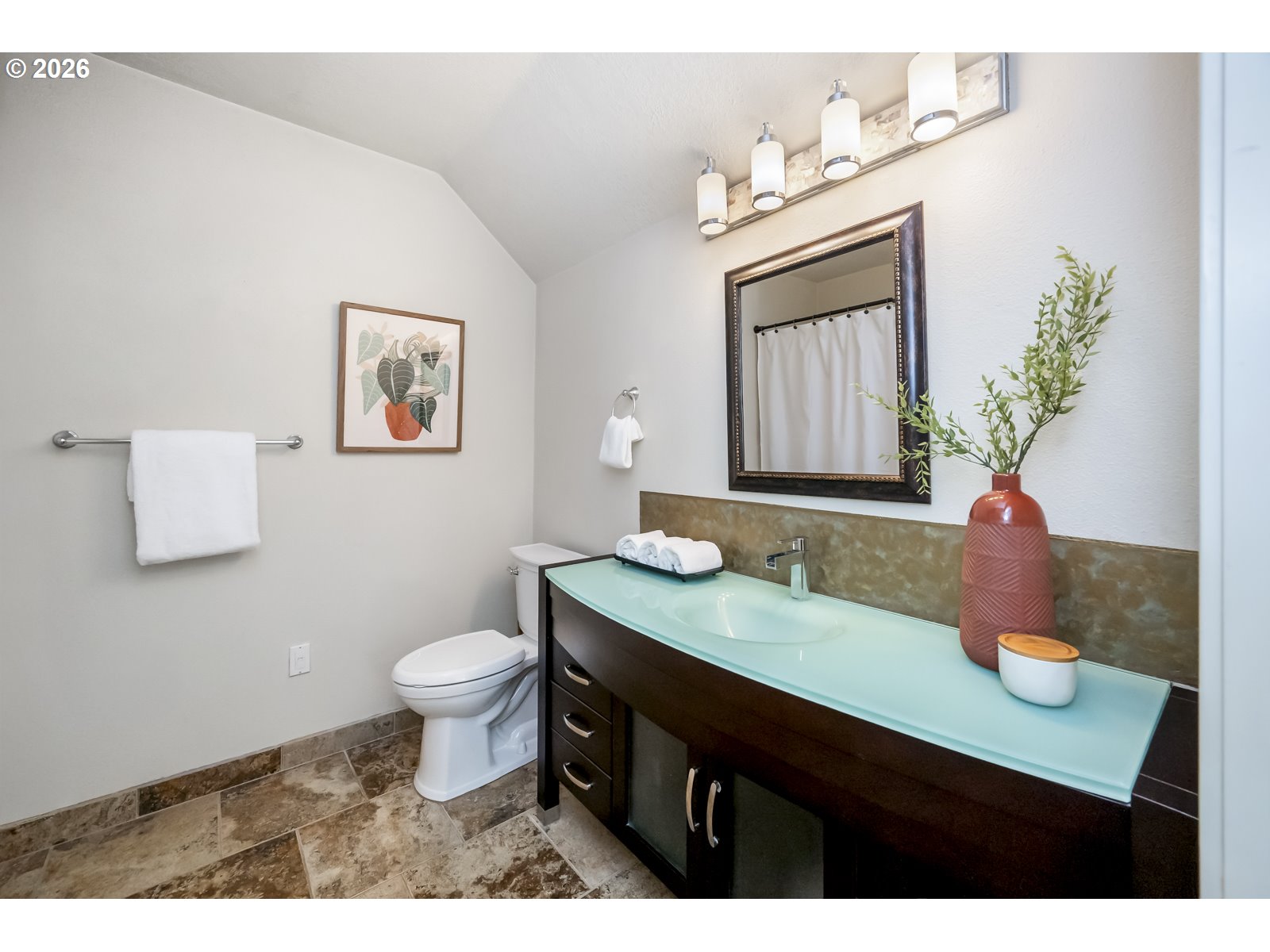 1100 Southwest 170th Avenue, Unit 100 Beaverton, OR 97003 - Photo 12 of 17 a bathroom with a sink a toilet and mirror