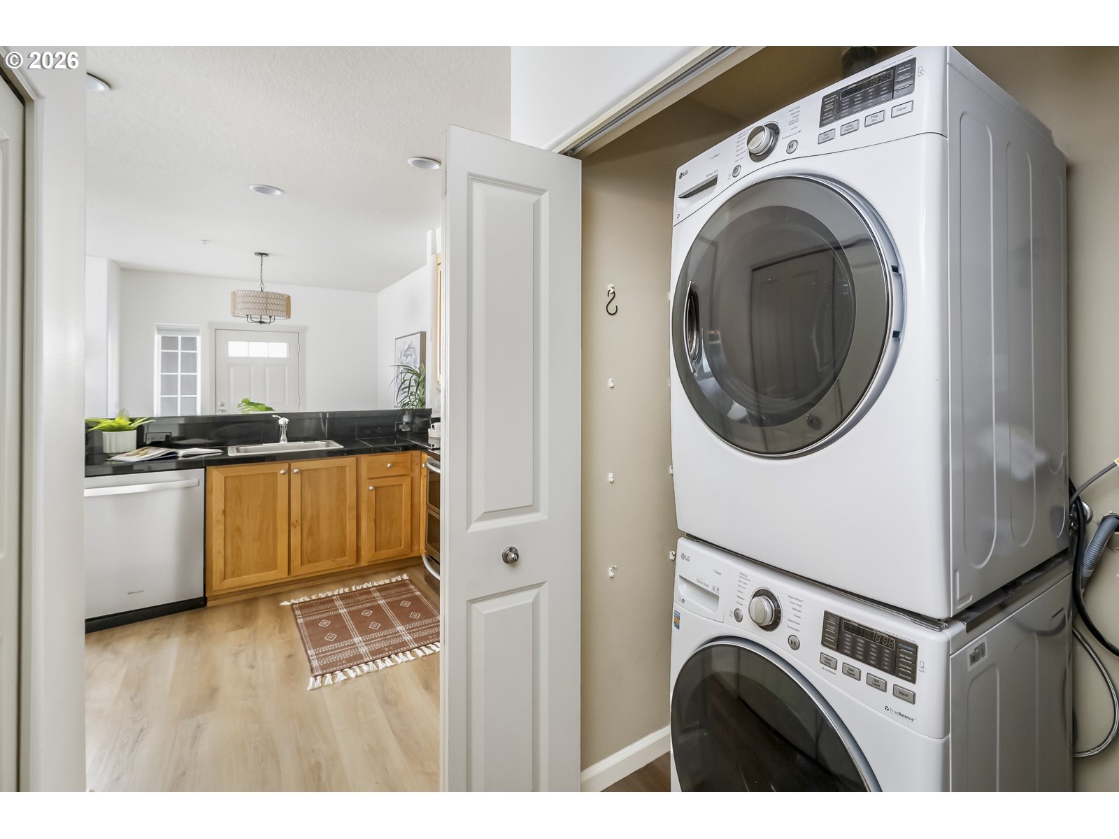 1100 Southwest 170th Avenue, Unit 100 Beaverton, OR 97003 - Photo 14 of 17 a view of kitchen with washer and dryer