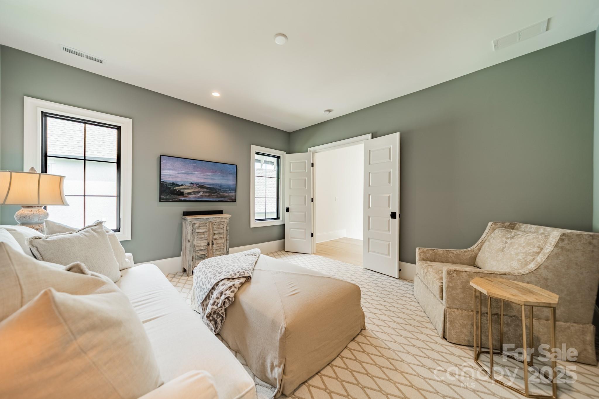 430 Bramble Way Fort Mill, SC 29708 - Photo 20 of 45 a spacious bedroom with a bed and a flat screen television