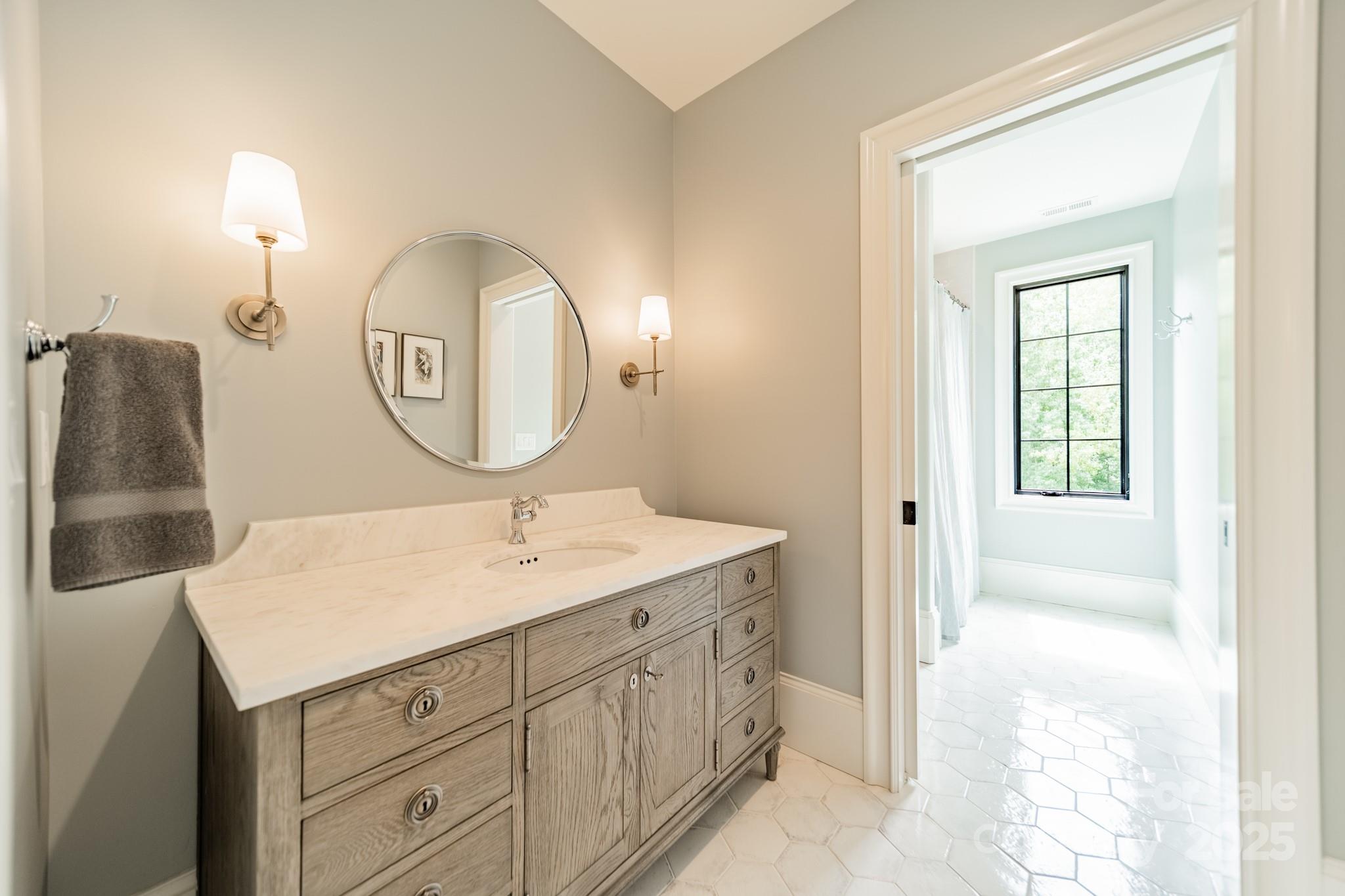430 Bramble Way Fort Mill, SC 29708 - Photo 24 of 45 a bathroom with a sink and a mirror