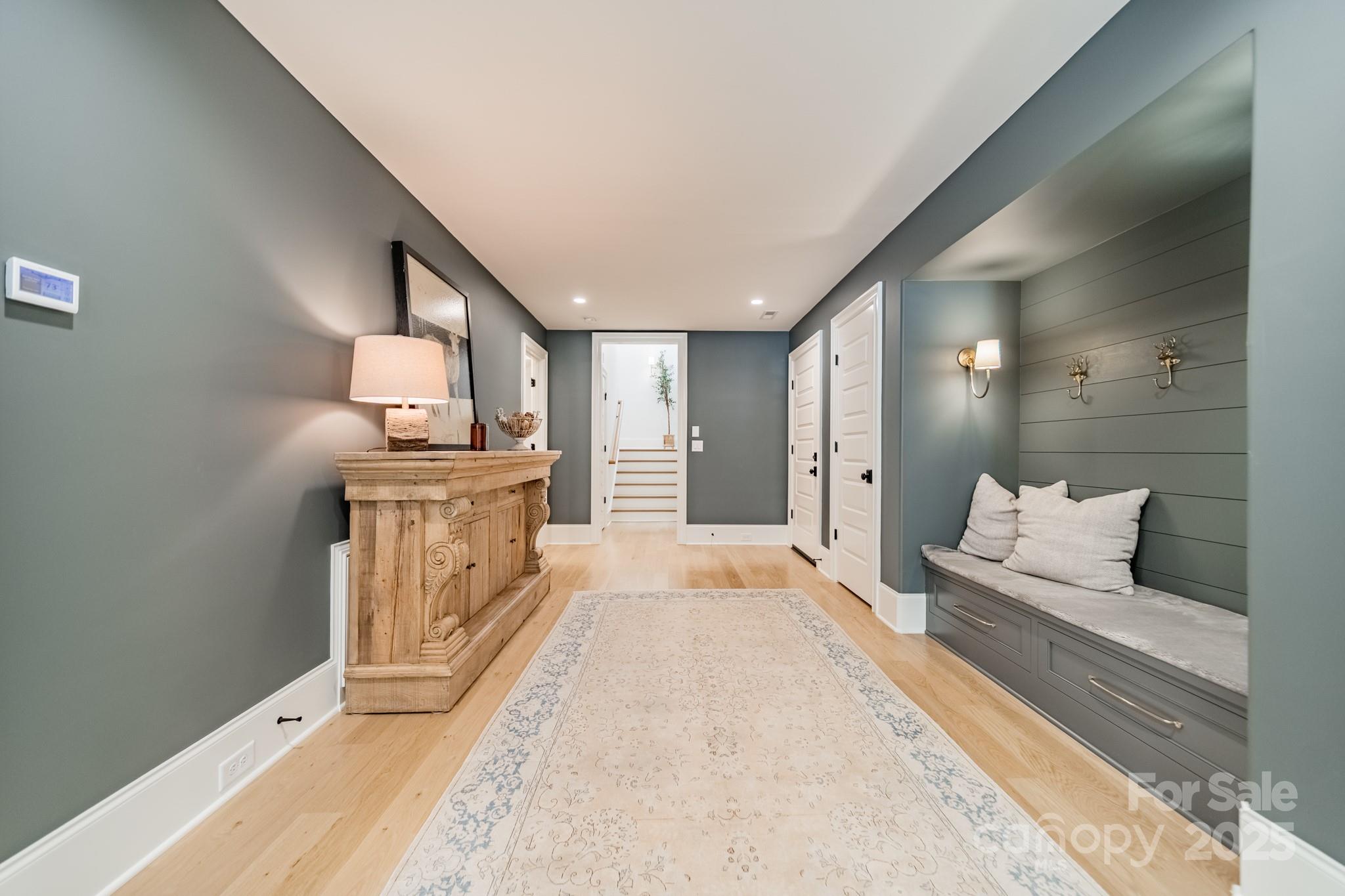 430 Bramble Way Fort Mill, SC 29708 - Photo 27 of 45 a large white kitchen with a white countertops and a fireplace