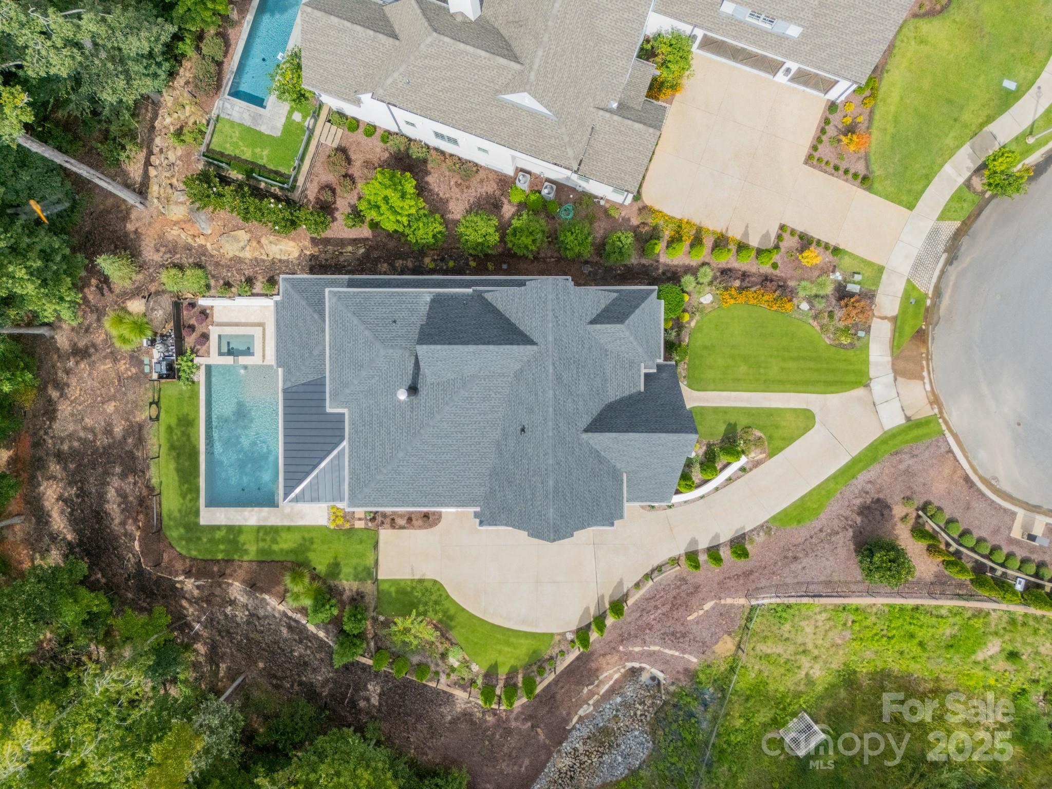 430 Bramble Way Fort Mill, SC 29708 - Photo 40 of 45 an aerial view of a house with a yard and a large pool