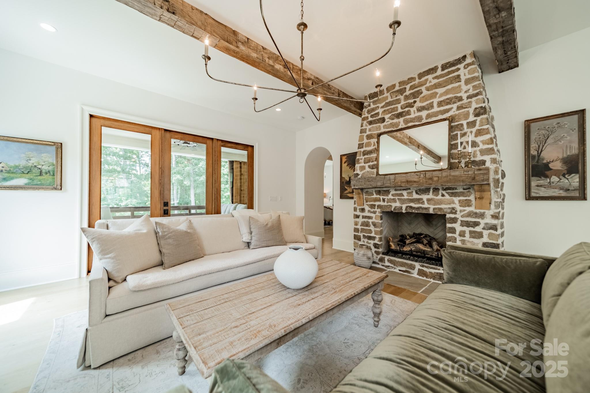 430 Bramble Way Fort Mill, SC 29708 - Photo 10 of 45 a living room with furniture a fireplace and a table