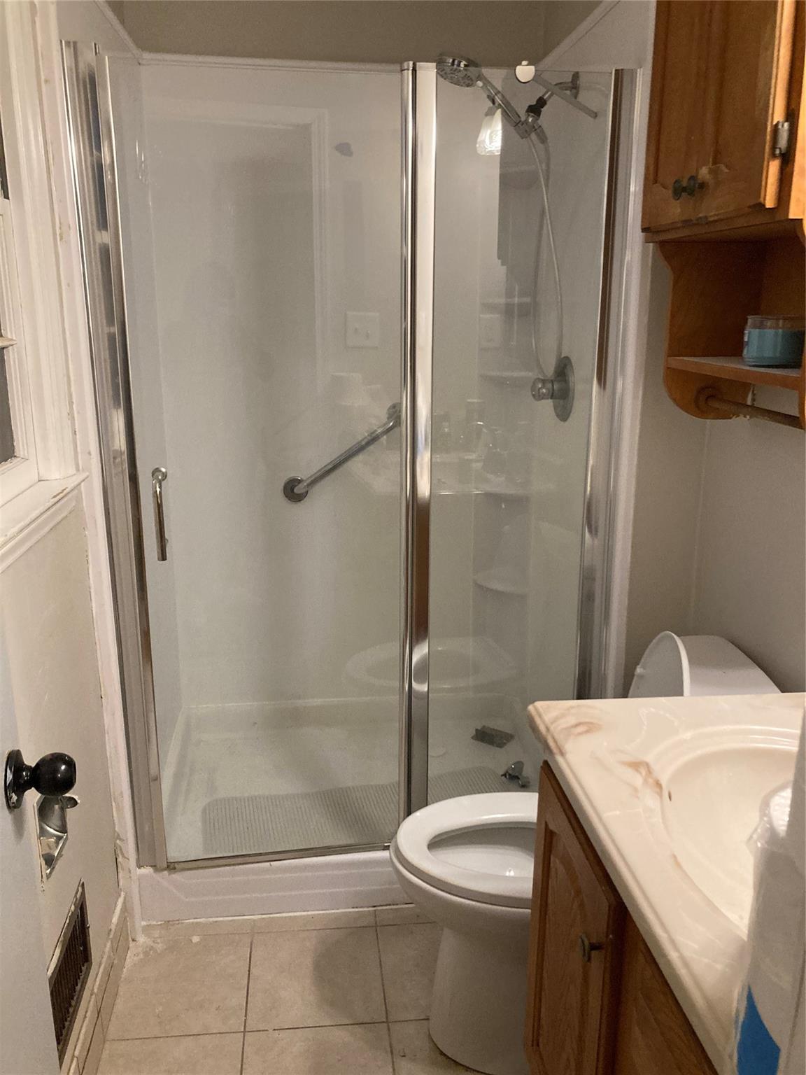 7530 Riding Trail Road Charlotte, NC 28212 - Photo 11 of 20 a bathroom with a granite countertop sink toilet and shower