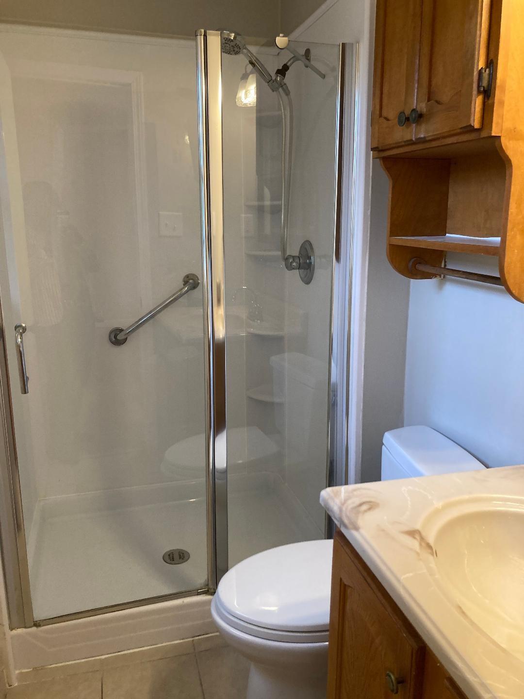 7530 Riding Trail Road Charlotte, NC 28212 - Photo 16 of 20 a bathroom with a granite countertop sink toilet and shower