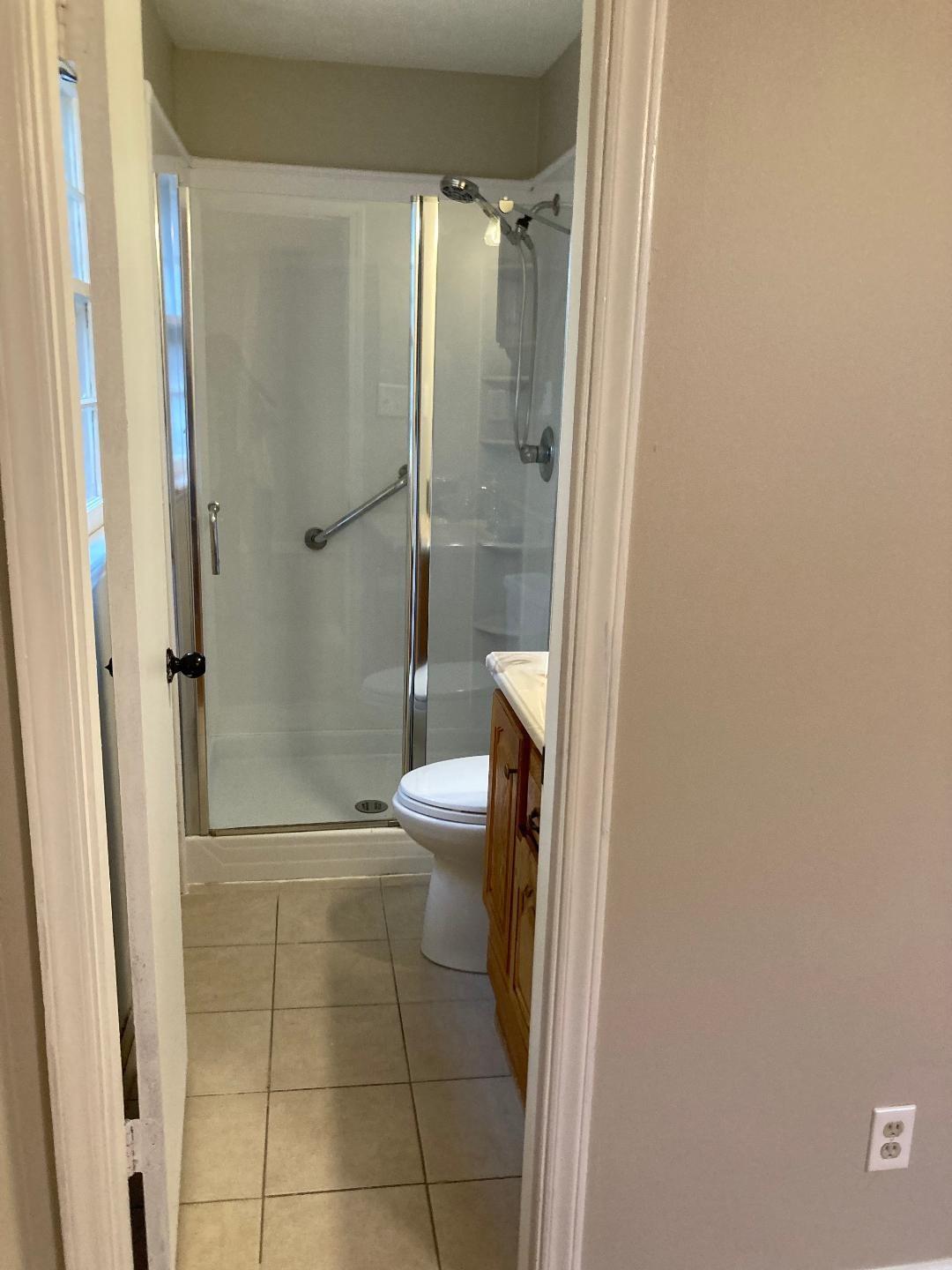 7530 Riding Trail Road Charlotte, NC 28212 - Photo 17 of 20 a bathroom with a toilet and a shower