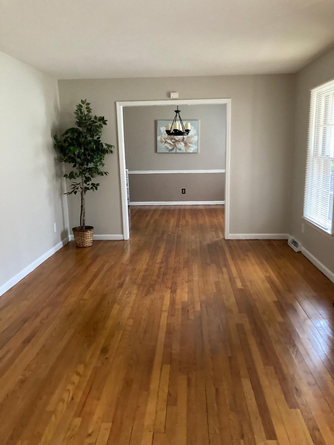 7530 Riding Trail Road Charlotte, NC 28212 - Photo 3 of 20 wooden floor in a livingroom with a window