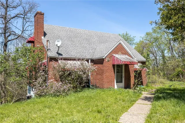 a backyard of a house with lots of green space