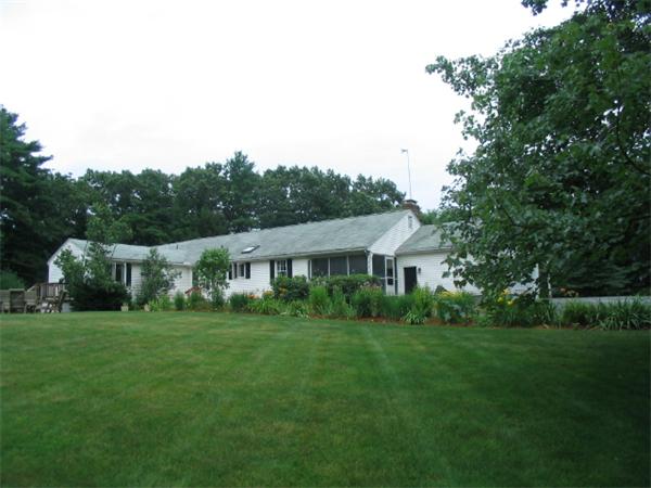 27 Torrey Road Sutton, MA 01590 - Photo 1 of 30 a view of a house with a big yard potted plants and large tree