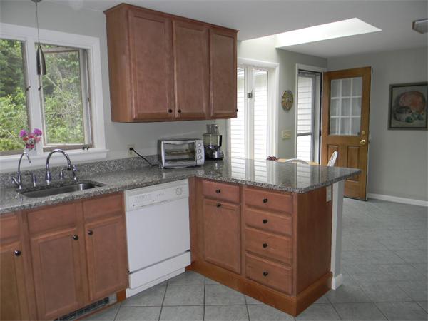 27 Torrey Road Sutton, MA 01590 - Photo 8 of 30 a kitchen with cabinets appliances and a window