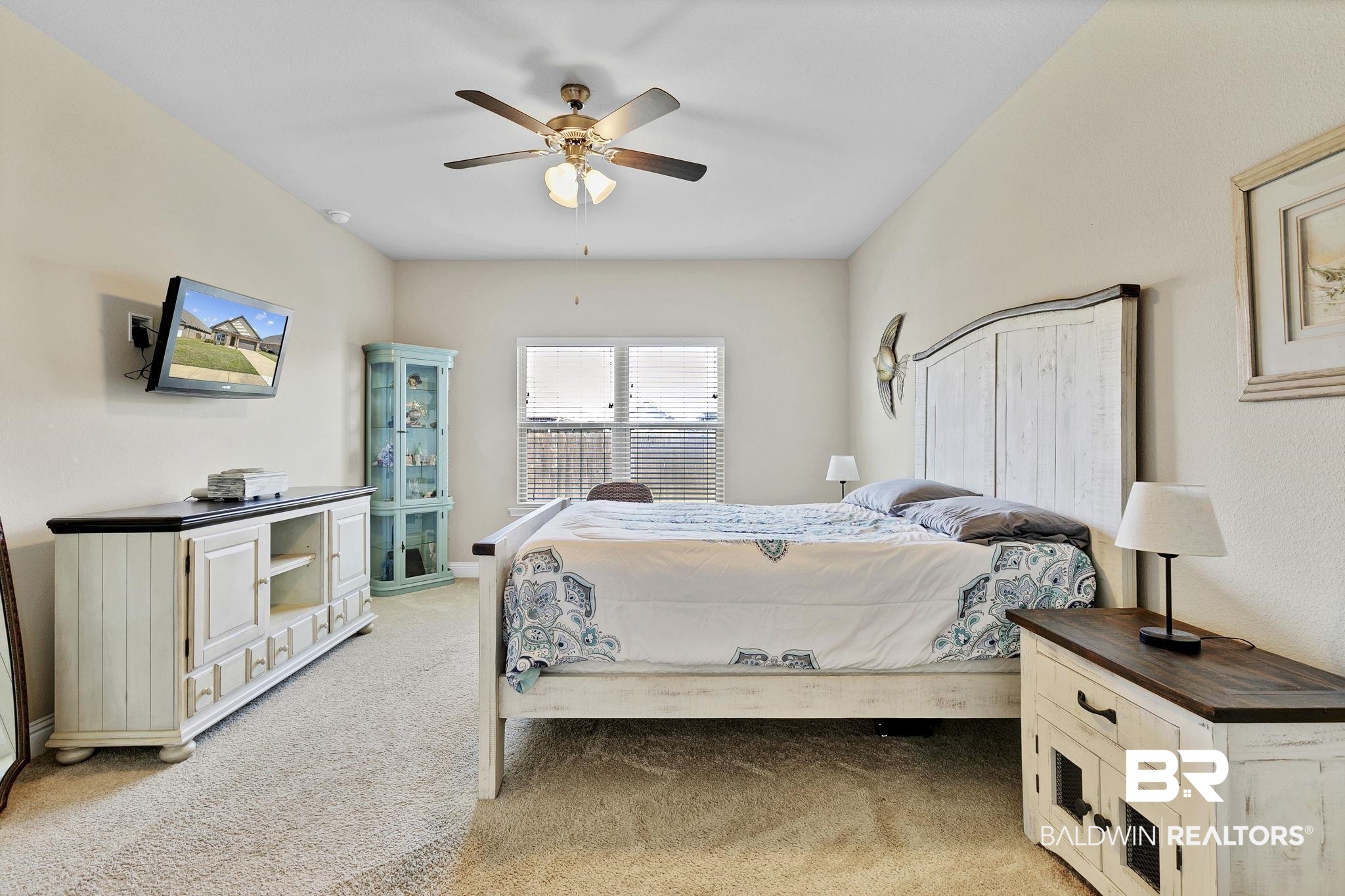 1547 Kairos Loop Foley, AL 36535 - Photo 19 of 55 Bedroom featuring a ceiling fan and light colored carpet