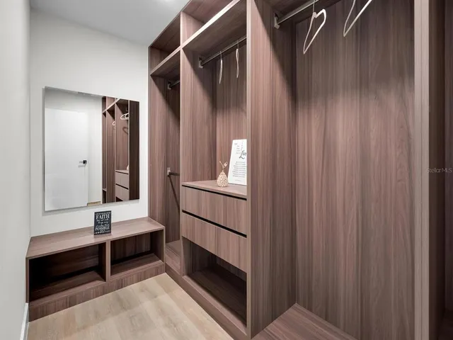 a view of an empty room and wooden floor