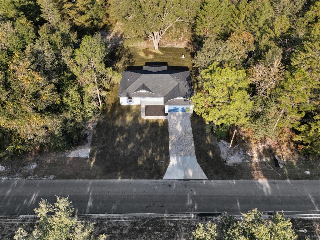11790 Orange Road Ocklawaha, FL 32179 - Photo 20 of 21 an aerial view of a house with a yard